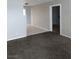 Living room leading to a tile floored room and carpeted floors at 621 Van Ert Ave, North Las Vegas, NV 89030