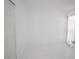 Bright bedroom featuring white walls, white trim, and tiled floors at 6215 Don Zarembo Ave, Las Vegas, NV 89108