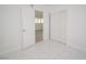 Bright bedroom featuring white walls, white trim, and tiled floors at 6215 Don Zarembo Ave, Las Vegas, NV 89108