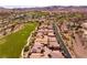 Beautiful aerial view overlooking homes and golf course with mountains in the background at 63 Via Di Mello, Henderson, NV 89011