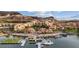 Breathtaking aerial view showcasing the waterfront community with boats docked along the pier at 63 Via Di Mello, Henderson, NV 89011