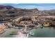 Amazing aerial view of a community on the lake, complete with docks, boats, and waterfront residences at 63 Via Di Mello, Henderson, NV 89011