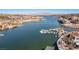 Scenic aerial view of a waterfront community with private docks, showcasing the beautiful lake and homes at 63 Via Di Mello, Henderson, NV 89011