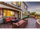 Cozy back patio with comfortable seating, lush landscaping, and relaxing ambiance at 63 Via Di Mello, Henderson, NV 89011