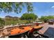 Spacious backyard with patio furniture, water feature, and mountain views at 63 Via Di Mello, Henderson, NV 89011