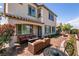 Picturesque backyard oasis featuring a manicured garden and comfortable seating area at 63 Via Di Mello, Henderson, NV 89011