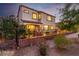 Charming backyard with flowering plants, manicured landscaping and a cozy seating area at 63 Via Di Mello, Henderson, NV 89011