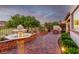Evening view of a serene backyard featuring manicured landscaping at 63 Via Di Mello, Henderson, NV 89011