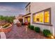 Exterior view of the home with a landscaped backyard and patio at 63 Via Di Mello, Henderson, NV 89011