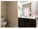 Half bathroom featuring dark cabinet vanity and tile floor at 63 Via Di Mello, Henderson, NV 89011