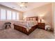 Bedroom with ceiling fan, window with shutters, and patterned comforter at 63 Via Di Mello, Henderson, NV 89011