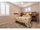 Bedroom with neutral paint, carpet and shutters at 63 Via Di Mello, Henderson, NV 89011