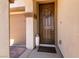 Inviting front entrance features a decorative wreath, custom front door, and manicured landscaping at 63 Via Di Mello, Henderson, NV 89011