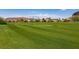 Expansive green golf course with manicured lawns and mature trees at 63 Via Di Mello, Henderson, NV 89011