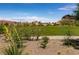 Scenic view of a well-maintained golf course surrounded by beautiful homes at 63 Via Di Mello, Henderson, NV 89011
