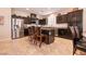 Well-appointed kitchen with stainless steel appliances, bar stool seating, and open layout for easy entertaining at 63 Via Di Mello, Henderson, NV 89011