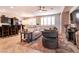 Bright, open concept area with a ceiling fan, plantation shutters, and tile floors, great for entertaining at 63 Via Di Mello, Henderson, NV 89011
