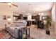 Open concept living and dining area with neutral tones, stainless steel appliances, and stylish lighting at 63 Via Di Mello, Henderson, NV 89011