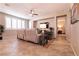 Inviting living space with a large window, ceiling fan, and open doorway leading to a bedroom at 63 Via Di Mello, Henderson, NV 89011