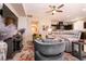 Comfortable living space featuring a TV, furniture, and open access to other rooms in the house at 63 Via Di Mello, Henderson, NV 89011