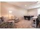 Loft featuring a pool table, accent chairs, a ceiling fan, and plantation shutters at 63 Via Di Mello, Henderson, NV 89011