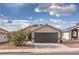 Charming single story home featuring a two car garage and low maintenance desert landscaping at 6438 Rose Tree Ln, Las Vegas, NV 89156