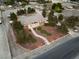 Expansive aerial view shows large lot, manicured lawn, driveway and proximity to neighboring properties at 6931 Leon Ave, Las Vegas, NV 89131