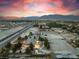 Sunset aerial view of a property with a well-maintained home and expansive lot at 6931 Leon Ave, Las Vegas, NV 89131