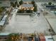 Aerial view of the property with a large dirt lot at 6931 Leon Ave, Las Vegas, NV 89131