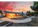 Beautiful backyard with a concrete patio, lush landscaping, a gazebo, and ample space for relaxation and recreation at 6931 Leon Ave, Las Vegas, NV 89131