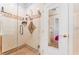 Bathroom shower with glass enclosure, tile accents, with view into an adjacent bathroom at 6931 Leon Ave, Las Vegas, NV 89131