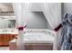 Bathroom with a soaking tub behind curtains and a dual sink vanity at 6931 Leon Ave, Las Vegas, NV 89131