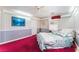 Cozy bedroom featuring a ceiling fan, a quaint quilt and carpet at 6931 Leon Ave, Las Vegas, NV 89131