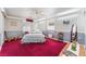 Comfortable bedroom with patterned wallpaper, carpet, and classic furnishings at 6931 Leon Ave, Las Vegas, NV 89131