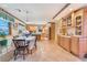 Well-lit kitchen and dining area featuring light wood cabinets and plenty of natural light at 6931 Leon Ave, Las Vegas, NV 89131