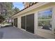 This home features an outdoor living space with large sliding glass doors at 7012 Bright Springs Ct, Las Vegas, NV 89113