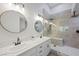 Modern bathroom with double sinks, stylish fixtures, and a frameless glass shower at 7012 Bright Springs Ct, Las Vegas, NV 89113