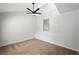 Bright bedroom with vaulted ceilings, ceiling fan and carpeted floors, offering a serene and comfortable space at 7012 Bright Springs Ct, Las Vegas, NV 89113