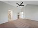 Spacious bedroom with vaulted ceilings, ceiling fan, and ensuite bathroom at 7012 Bright Springs Ct, Las Vegas, NV 89113