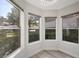 Sunlit breakfast nook with large windows offering scenic views of the surrounding neighborhood at 7012 Bright Springs Ct, Las Vegas, NV 89113