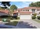Home exterior showcasing the well-maintained landscaping and a two-car garage at 7012 Bright Springs Ct, Las Vegas, NV 89113
