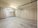 Spacious garage equipped with ample storage cabinets and room for multiple vehicles at 7012 Bright Springs Ct, Las Vegas, NV 89113