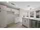 Bright kitchen with stainless steel appliances, light countertops, and a view of the backyard at 7012 Bright Springs Ct, Las Vegas, NV 89113