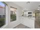 Well-lit kitchen with marble counters, stainless appliances and an open floor plan at 7012 Bright Springs Ct, Las Vegas, NV 89113