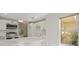 Well-lit kitchen with marble counters, stainless appliances and an open floor plan at 7012 Bright Springs Ct, Las Vegas, NV 89113