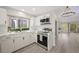 Modern kitchen with stainless steel appliances, quartz counters, and lots of light at 7012 Bright Springs Ct, Las Vegas, NV 89113
