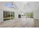 Open floor plan living room featuring new floors and lots of natural light at 7012 Bright Springs Ct, Las Vegas, NV 89113