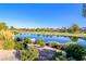 Breathtaking pond view in Spanish Trail community with lush vegetation at 7012 Bright Springs Ct, Las Vegas, NV 89113