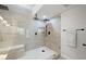 Elegant glass shower with tile accents, dual shower heads, and a built in bench at 7012 Bright Springs Ct, Las Vegas, NV 89113