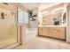 Bright bathroom with tile flooring features shower, tub, and double sink vanity with lots of space at 7497 Alamo Ranch Ave, Las Vegas, NV 89179